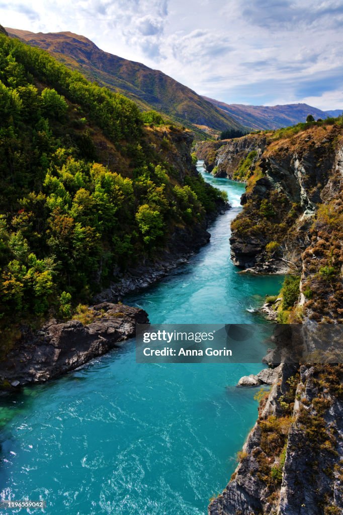 Aquamarine Kawarau River on summer afternoon outside Queenstown, New Zealand, downstream of original commercial bungy jumping site