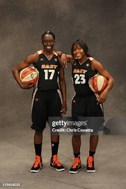 Essence Carson and Cappie Pondexter of the Eastern Conference All-Stars poses for a team photo at AT&T Center on July 23, 2011 in San Antonio, Texas....