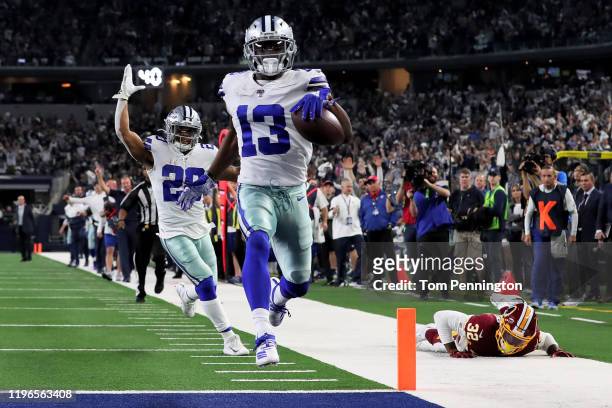 Michael Gallup of the Dallas Cowboys scores a touchdown in the third quarter against the Washington Redskins in the game at AT&T Stadium on December...