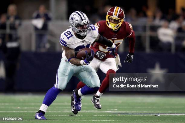 Ezekiel Elliott of the Dallas Cowboys runs with the ball in the third quarter against the Washington Redskins in the game at AT&T Stadium on December...