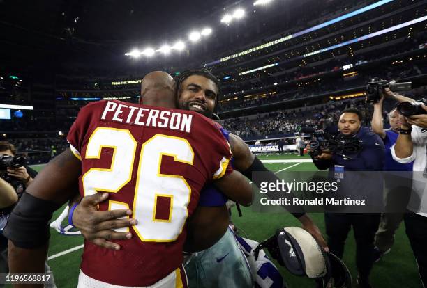 Adrian Peterson of the Washington Redskins with Ezekiel Elliott of the Dallas Cowboys after the Cowboys defeated the Redskins 47-16 at AT&T Stadium...