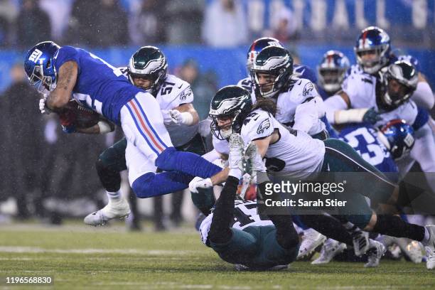 Cody Latimer of the New York Giants carries the ball on the return and is tackled by the Philadelphia Eagles during the second half of the game at...