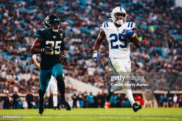 Hayden of the Jacksonville Jaguars chases Marlon Mack of the Indianapolis Colts into the end zone for a touchdown in the second quarter at TIAA Bank...