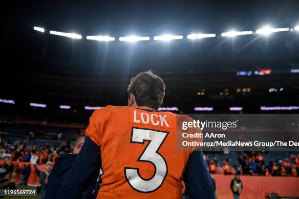 Drew Lock of the Denver Broncos walks off the field after the fourth quarter of Denver's 16-15 win over the Oakland Raiders on Sunday, December 28,...