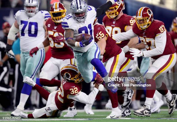 Ezekiel Elliott of the Dallas Cowboys carries the ball against the Washington Redskins in the second quarter at AT&T Stadium on December 29, 2019 in...