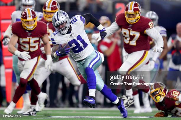 Ezekiel Elliott of the Dallas Cowboys carries the ball against the Washington Redskins in the second quarter at AT&T Stadium on December 29, 2019 in...