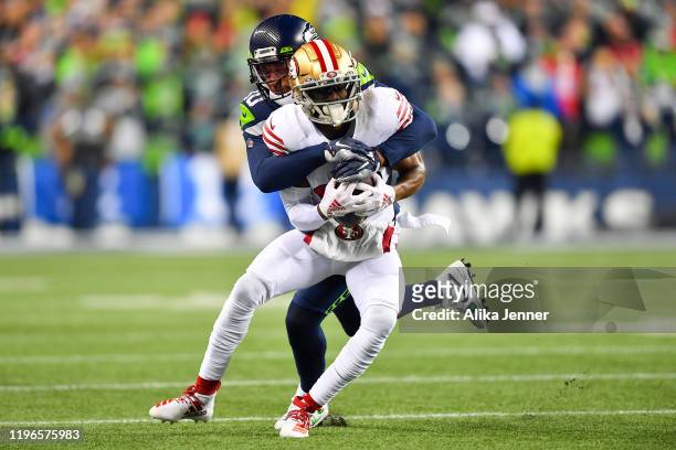 Emmanuel Sanders of the San Francisco 49ers catches a pass against Bradley McDougald of the Seattle Seahawks during the first quarter of the game at...
