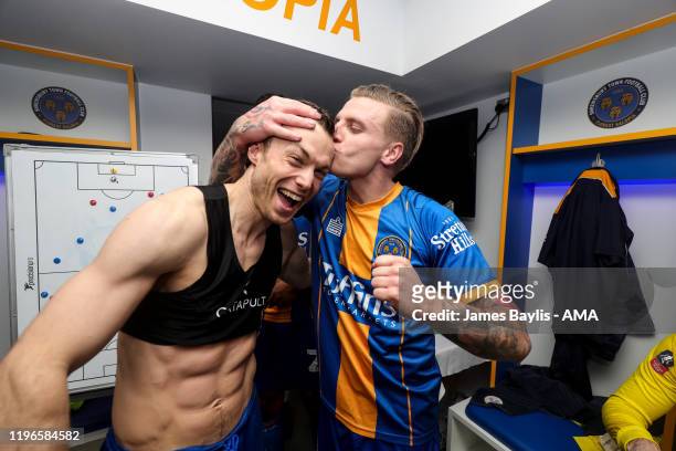 Shaun Whalley of Shrewsbury Town and Jason Cummings of Shrewsbury Town celebrate at full time in the dressing room during the FA Cup Fourth Round...