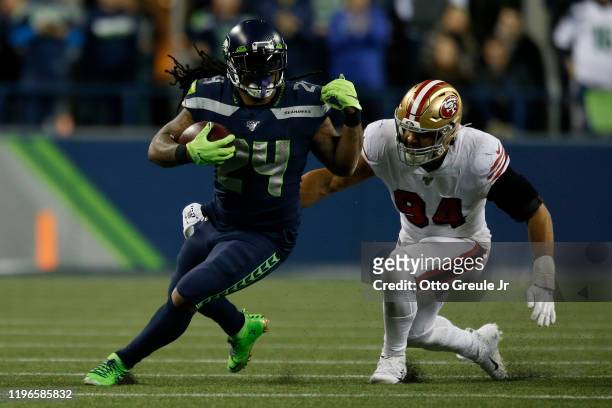 Running back Marshawn Lynch of the Seattle Seahawks runs the ball against defensive end Solomon Thomas of the San Francisco 49ers during the game at...