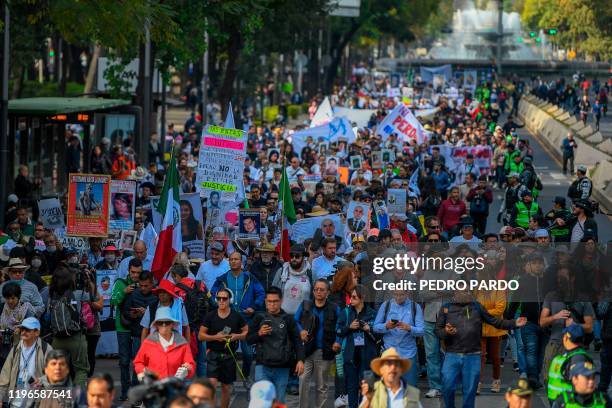 People take part in a march for peace in Mexico City, on January 26, 2020. - The march for peace, led by Mexican poet and activist Javier Sicilia and...