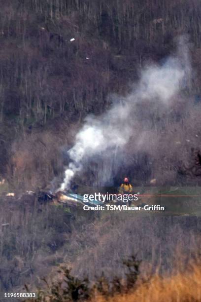 The site of a helicopter crash that claimed the lives of former NBA great Kobe Bryant and his daughter Gianna Bryant is shown January 26, 2020 in...