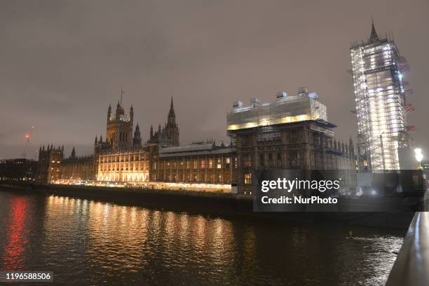 Night view of Westminster Palace and Big Ben covered in scaffolding during renovation work. On Wednesday, 22 January 2019, in London, United Kingdom.