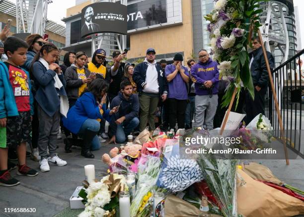 General view outside of the Staples Center where a makeshift memorial for Kobe Bryant has been setup by fans who have gathered to honor the...