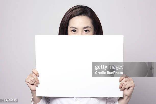 holding whiteboard ,young business woman - women only holding placards stock-fotos und bilder