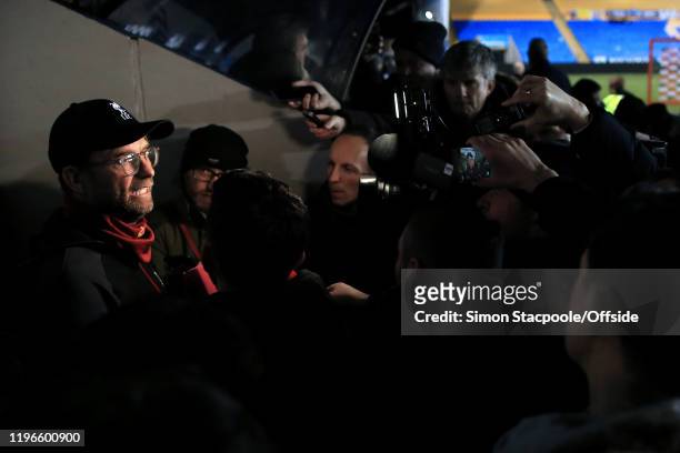 Liverpool manager Jurgen Klopp is surrounded by members of the media as he is interviewed after the FA Cup Fourth Round match between Shrewsbury Town...
