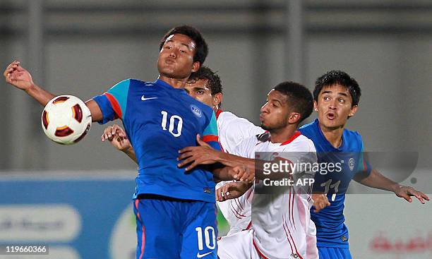 India's Jeje Lalpekhlua challenges UAE's Amir Mubarak during their 2014 World Cup Asian zone qualifying football match in Al-Ain on July 23, 2011....