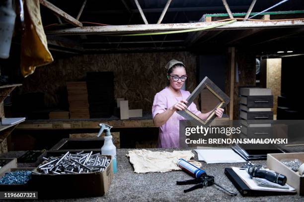 Worker assembles cabinet doors at Riverside RV, builders of recreational vehicles, on January 24, 2020 in LaGrange, Indiana. - The six or seven...