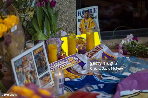 People mourn at a makeshift memorial at Mamba Sports Academy for former NBA great Kobe Bryant, who was killed in a helicopter crash while commuting...