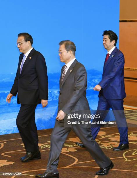 South Korean President Moon Jae-in, Chinese Premier Li Keqiang and Japanese Prime Minister Shinzo Abe are seen prior to the South Korea-Japan-China...