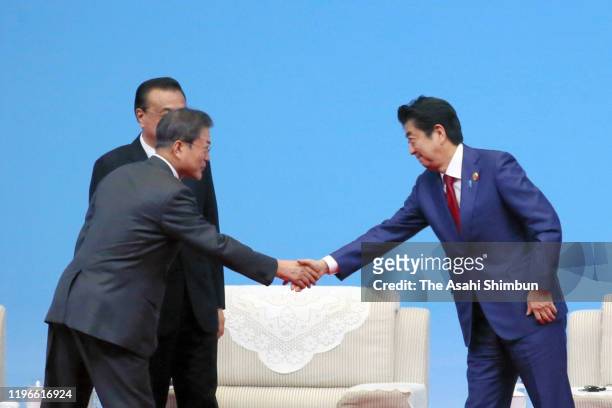 South Korean President Moon Jae-in, Chinese Premier Li Keqiang and Japanese Prime Minister Shinzo Abe attend the South Korea-Japan-China Business...