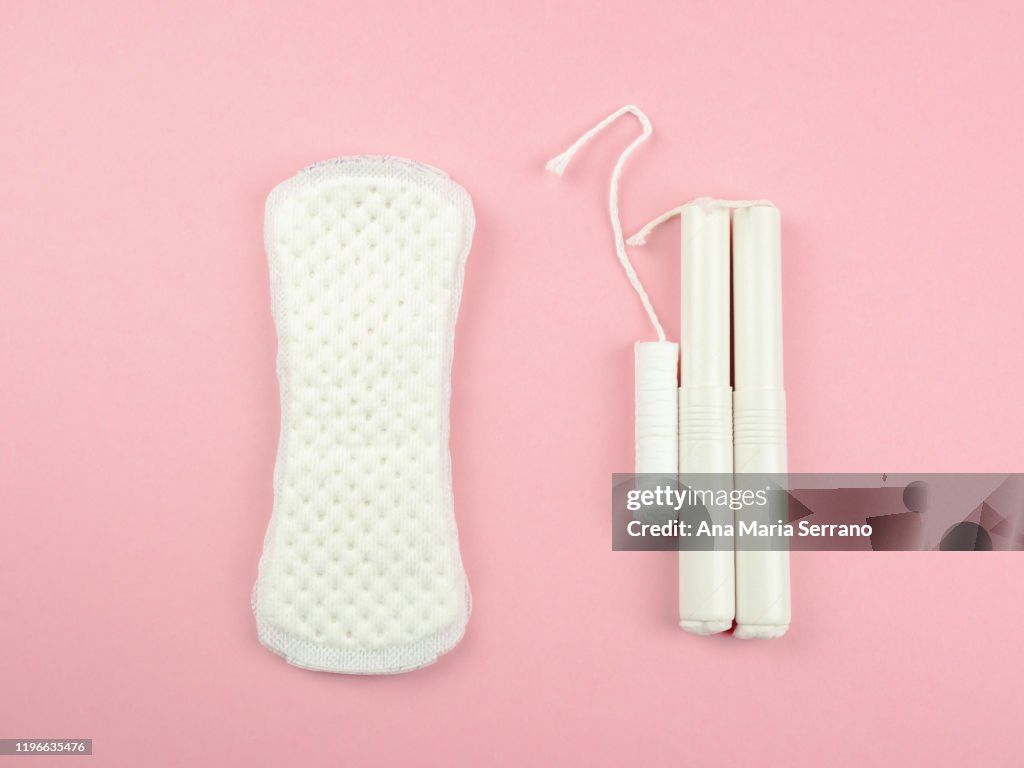 Organic cotton hygienic wipes and an organic cotton hygienic tampon. Concept of ecology and feminine hygiene.