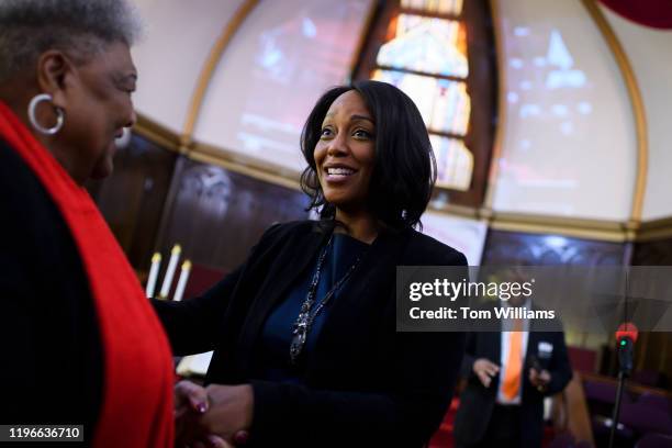 Maya Rockeymoore Cummings, Democratic candidate for Marylands 7th Congressional District, greets guests before service at the Zion Baptist Church in...