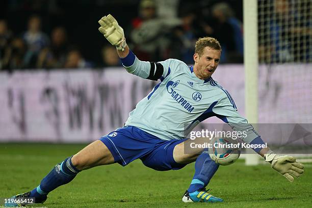 Ralf Faehrmann of Schalke saves a ball during the Supercup match between FC Schalke 04 and Borussia Dortmund at Veltins Arena on July 23, 2011 in...