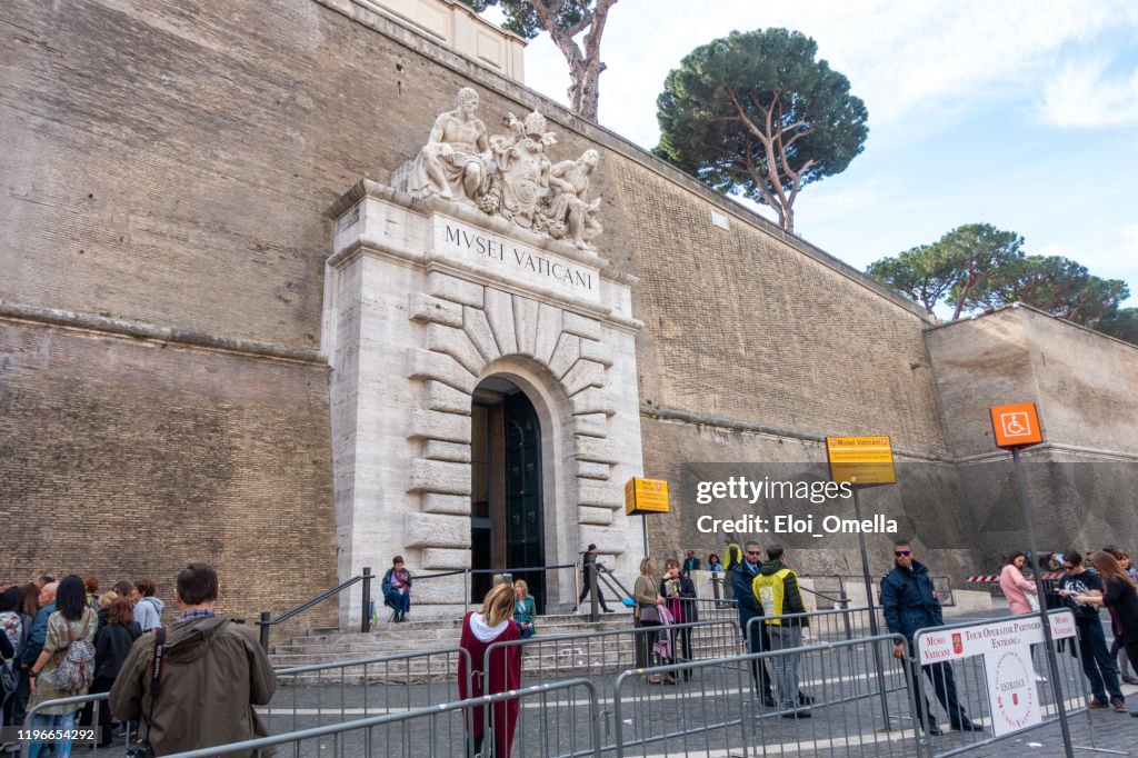 Tourists in front of main entrance to Vatican Museums, Rome, Italy