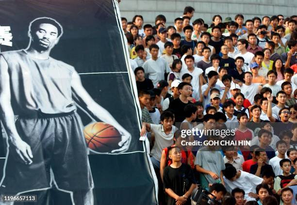 Chinese fans jeer at the Adidas officials after American NBA Star Kobe Bryant failed to turned up for a promotional event at the Beijing Millennium...