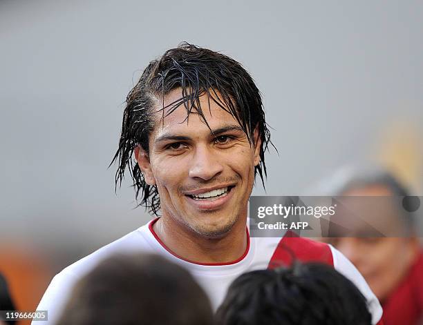 Peruvian forward Paolo Guerrero smiles after scoring his team´s second goal against Venezuela during the 2011 Copa America football tournament...