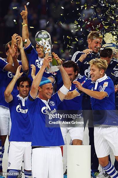 Players of Schalke celebrate after winning the Supercup match against Borussia Dortmund at Veltins Arena on July 23, 2011 in Gelsenkirchen, Germany.