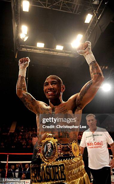 Ashley Theophane celebrates after he knocks out Jason Cook during the British Light welterweight Title fight at Wembley Arena on July 23, 2011 in...