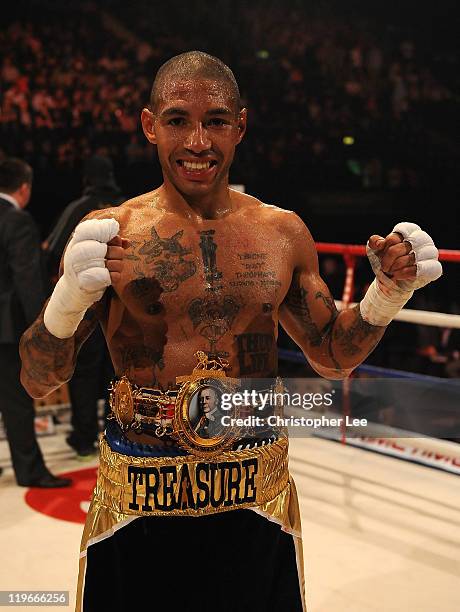 Ashley Theophane celebrates after he knocked out Jason Cook during the British Light welterweight Title fight at Wembley Arena on July 23, 2011 in...