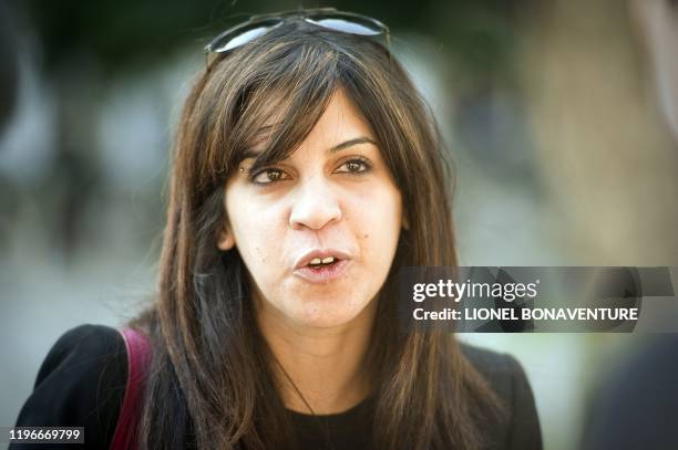 Famous Tunisian blogger Lina Ben Mhenni is seen on Bourguiba avenue in tunis on October 20 days before a historic national election in Tunisia. Arab...