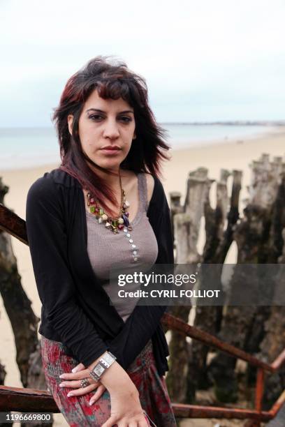 Tunisia's writer and blogger Lina Ben Mhenni poses on June 12, 2011 in Saint-Malo, Brittany, western France, during the 22nd edition of the...