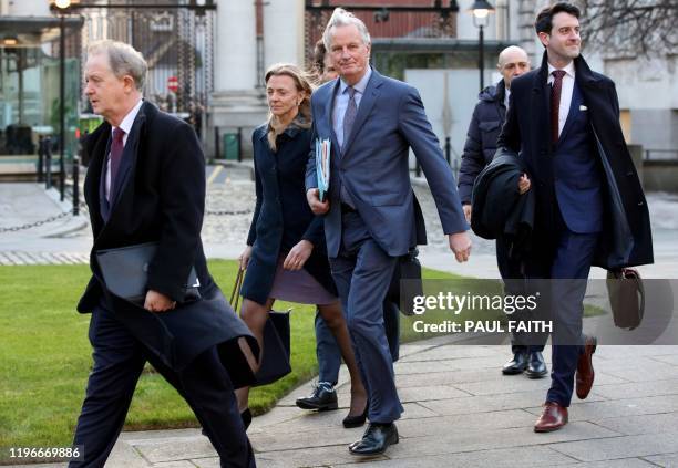 S chief Brexit negotiator Michel Barnier arrives with his team at Government Buildings in Dublin on January 27 ahead of his meeting with Ireland's...