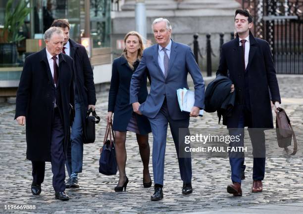 S chief Brexit negotiator Michel Barnier arrives with his team at Government Buildings in Dublin on January 27 ahead of his meeting with Ireland's...