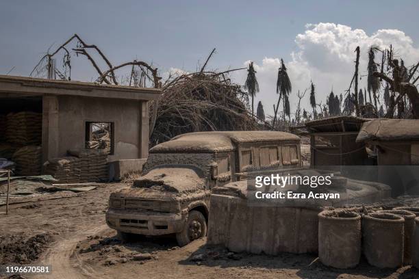 Truck is covered in volcanic ash on January 27, 2020 in the village of Banyaga, Agoncillo, Batangas province, Philippines. The Philippine Institute...