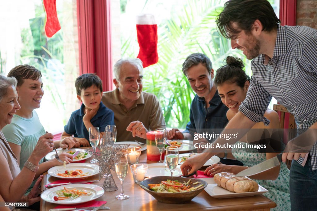 Family having a christmas eve lunch with a traditional matambre meat