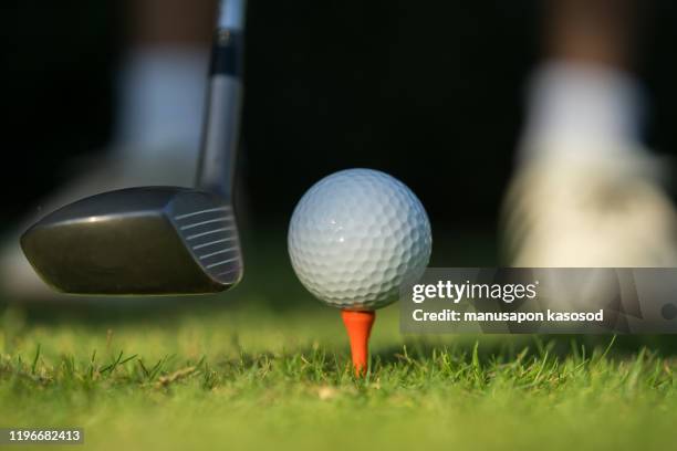 golfer is about to hit the ball. - driving range stock pictures, royalty-free photos & images