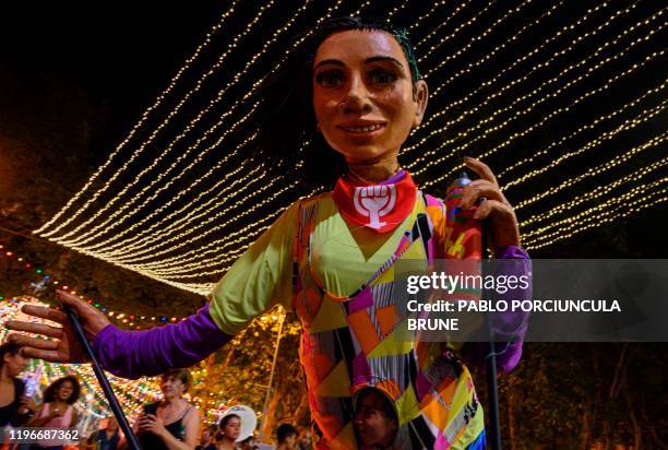 Performer from the French Les Grandes Personnes Artist-in-Residence program participates in the opening parade of the Uruguayan carnival, the world's...