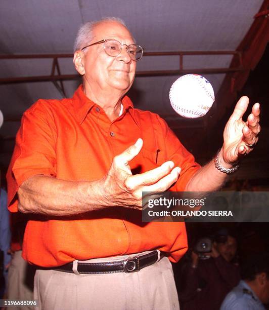 Enrique Bolanos, the presidential candidate for el Partido Liberal Constitucionalista, throws a baseball during the electoral campaign 31 October...