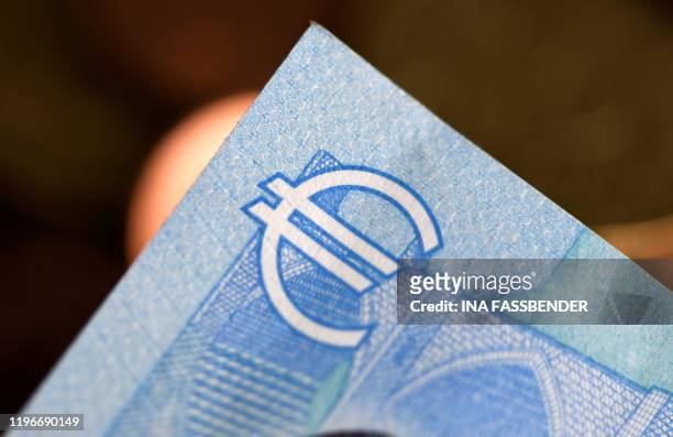 Picture taken on January 27, 2020 shows a detail of a twenty euros banknote in Dortmund, western Germany.