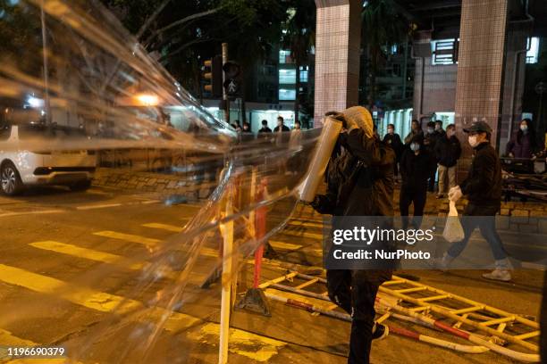 Protesters threw petrol bombs to at an empty public housing complex which is proposed Hong Kong virus quarantine building during the protest in...