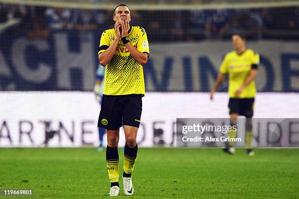 Kevin Grosskreutz of Dortmund reacts during the Supercup match between FC Schalke 04 and Borussia Dortmund at Veltins Arena on July 23, 2011 in...