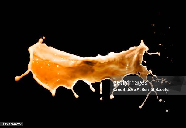 figures and abstract forms of coffee with milk on a black background. - milk wave stock pictures, royalty-free photos & images