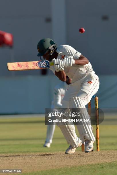 Zimbabwe's Tinotenda Mutombodzi ducks for a ball delivered by Sri Lanka's Suranga Lakmal during the fourth day of the fourth Test cricket match...