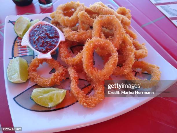 Fried Calamari Rings Photos and Premium High Res Pictures - Getty Images