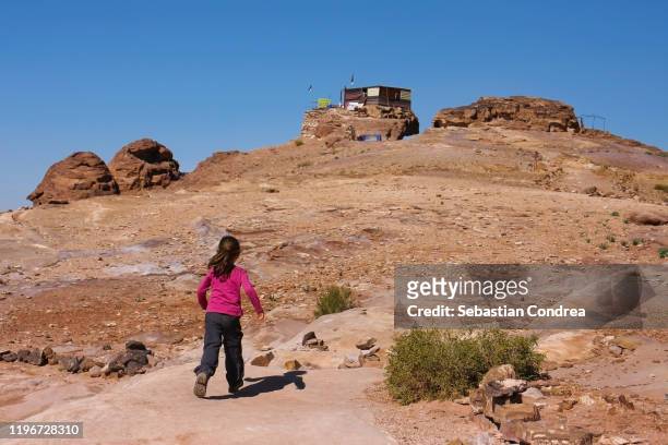 girl traveling through jordan country exploring the beautiful nature destinations, petra, jordan. - beautiful arabian girls stock pictures, royalty-free photos & images
