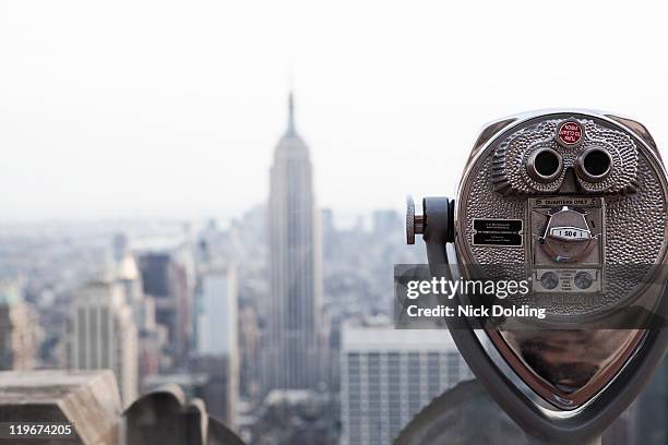 empire state building as seen from the rock - viewfinder stock pictures, royalty-free photos & images